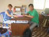 Jenny meeting with the Primary (Grades 1-3) teacher, Phin, working on lesson plans.